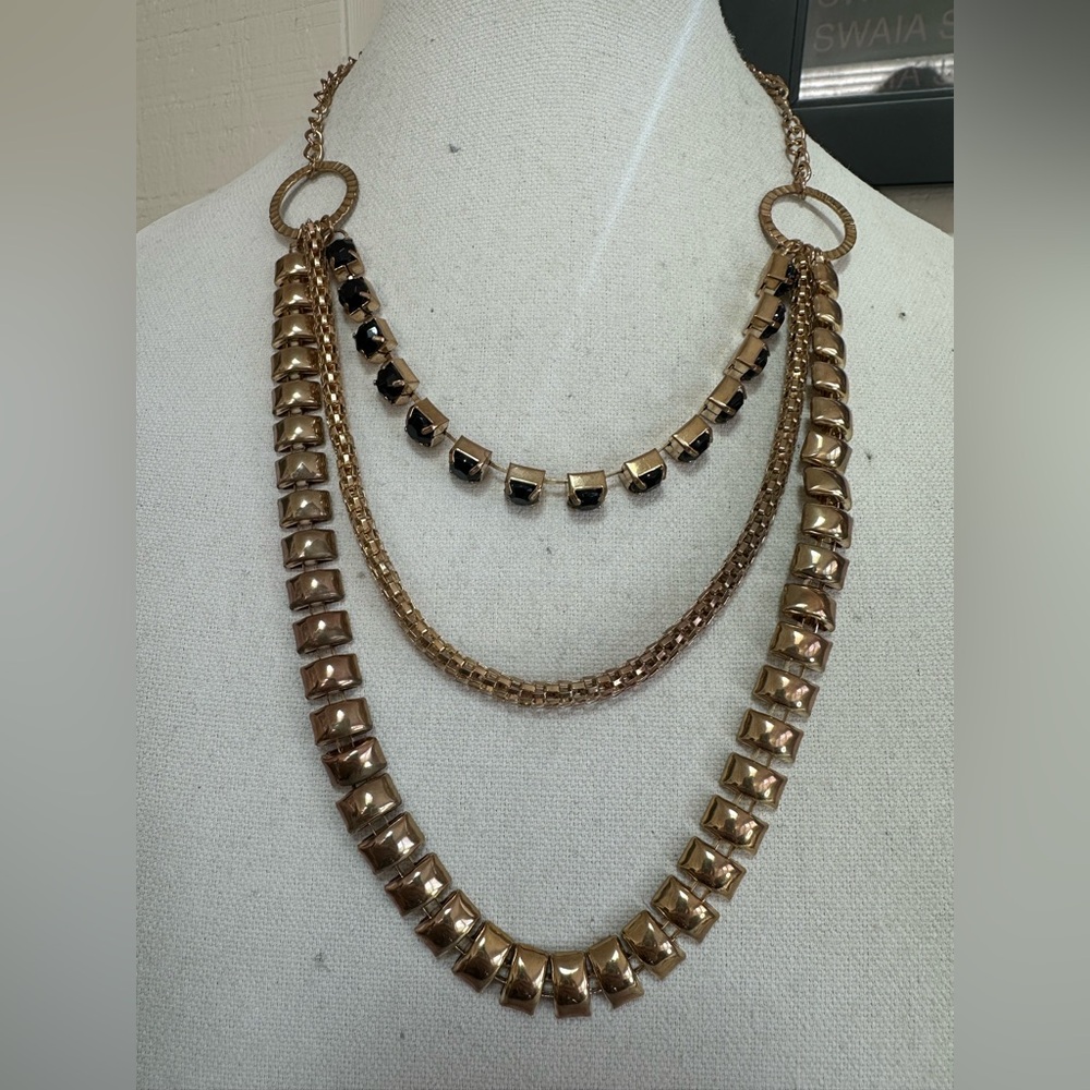 Triple strand goldtone and black rhinestone necklace